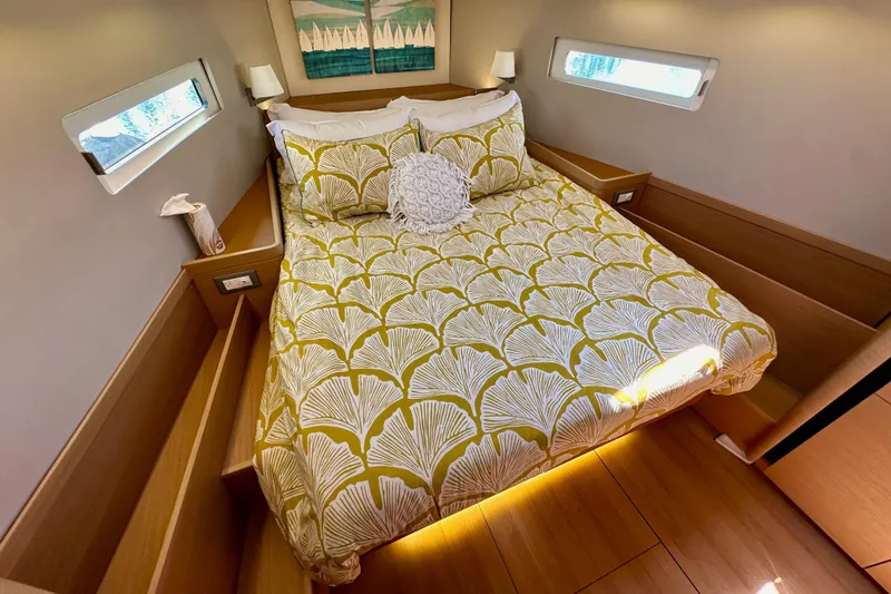 Slide: The Image of Cozy cabin interior of 2022 Jeanneau Sun Odyssey 410 with stylish bedding and modern decor. - 80