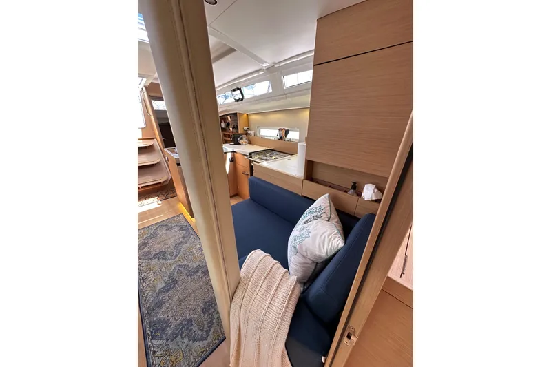 Slide: The Image of Interior of 2022 Jeanneau Sun Odyssey 410 yacht, featuring cozy seating and modern design. - 87