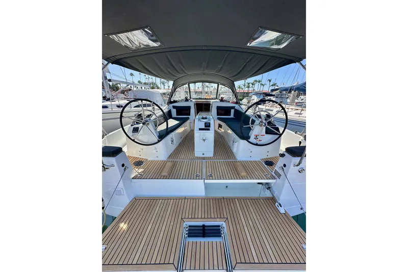 Slide: The Image of Cockpit of 2022 Jeanneau Sun Odyssey 410 sailboat with dual steering wheels. - 9