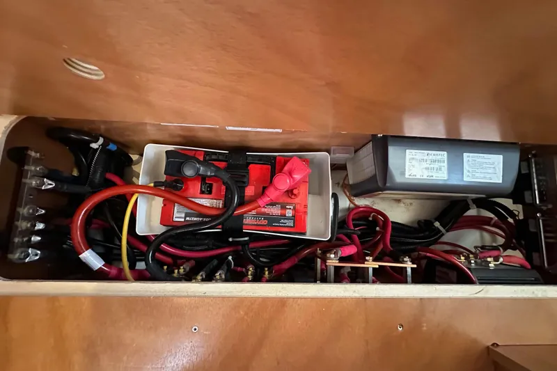 Slide: The Image of Electrical system of 2022 Jeanneau Sun Odyssey 410 sailboat, featuring batteries and wiring. - 95