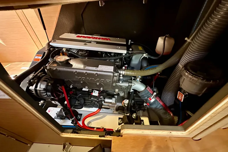 Slide: The Image of Engine compartment of 2022 Jeanneau Sun Odyssey 410 sailboat, showcasing detailed mechanical components. - 97