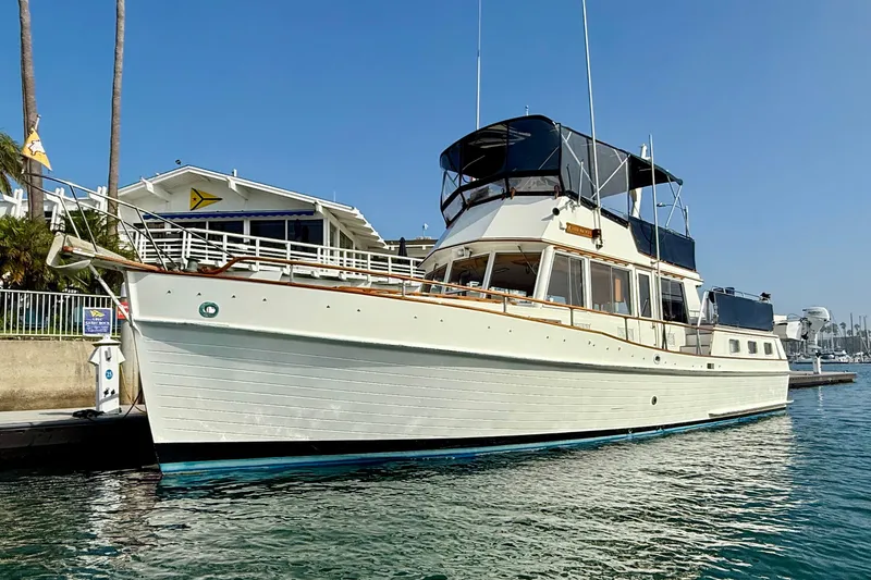 Slide: The Image of 1982 Grand Banks 42 Motoryacht docked in sunny marina setting. - 3