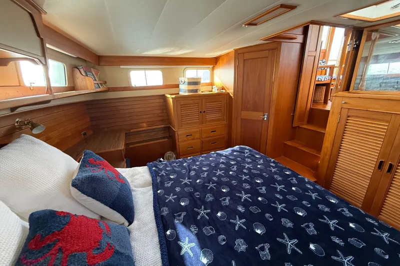 Slide: The Image of Cozy cabin interior of 1982 Grand Banks 42 Motoryacht with nautical decor and wooden furnishings. - 35
