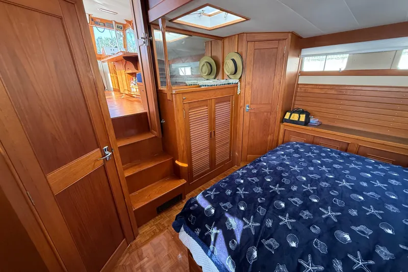 Slide: The Image of Cozy cabin interior of 1982 Grand Banks 42 Motoryacht with wooden furnishings and nautical decor. - 37