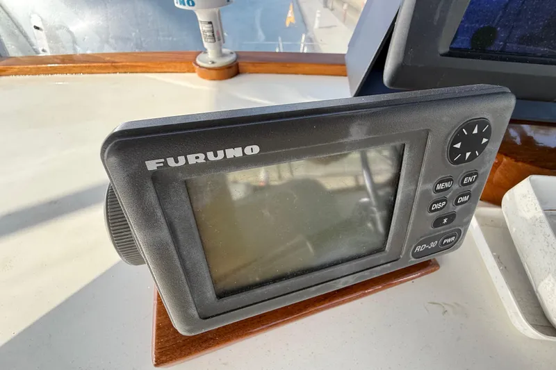 Slide: The Image of Furuno navigation device on 1982 Grand Banks 42 Motoryacht dashboard. - 42
