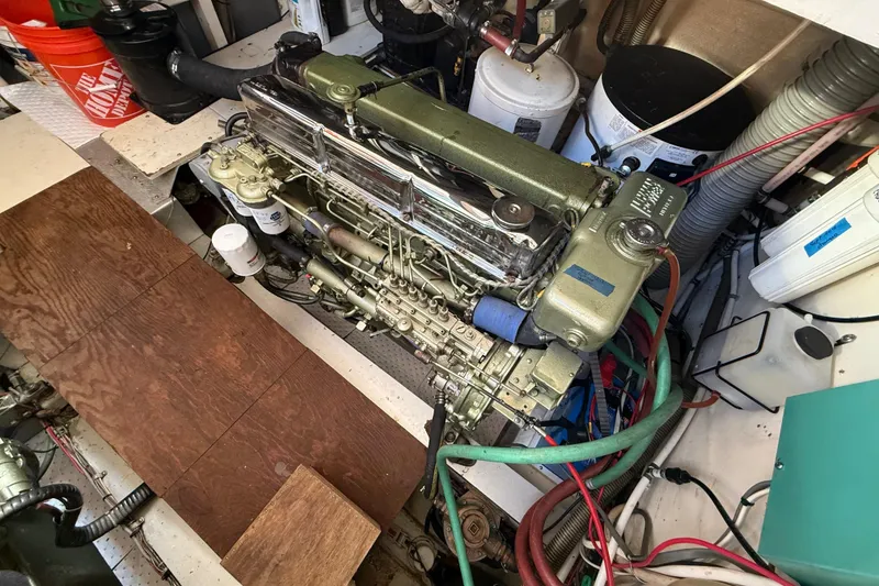 Slide: The Image of Engine room of a 1982 Grand Banks 42 Motoryacht, showcasing detailed machinery and components. - 45