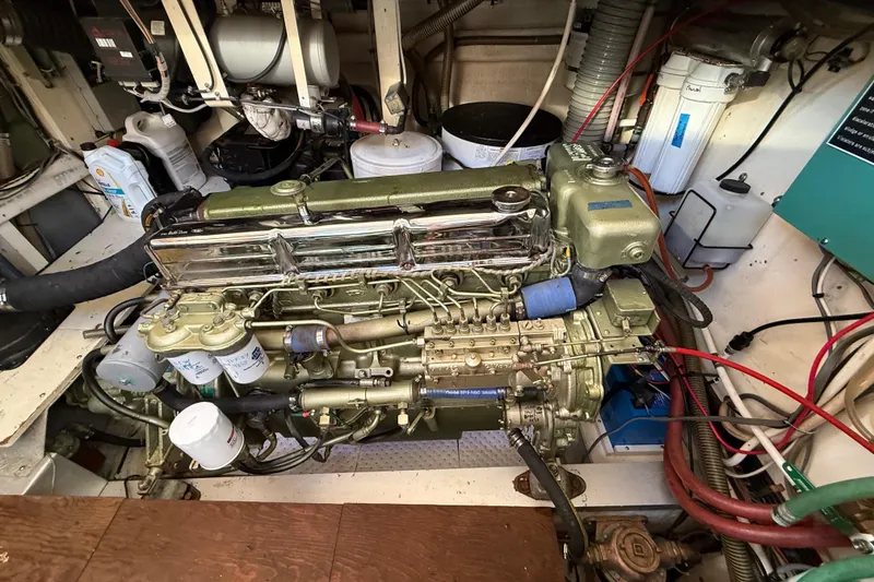 Slide: The Image of Engine room of a 1982 Grand Banks 42 Motoryacht, showcasing detailed mechanical components. - 48