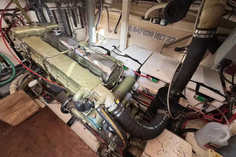 Slide: The Image of Engine room of 1982 Grand Banks 42 Motoryacht with visible engine and wiring. - 49