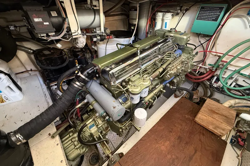 Slide: The Image of Engine room of a 1982 Grand Banks 42 Motoryacht, showcasing detailed mechanical components. - 50