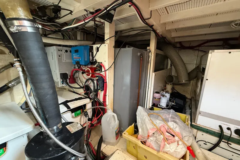 Slide: The Image of Engine room of 1982 Grand Banks 42 Motoryacht with wiring and equipment. - 53
