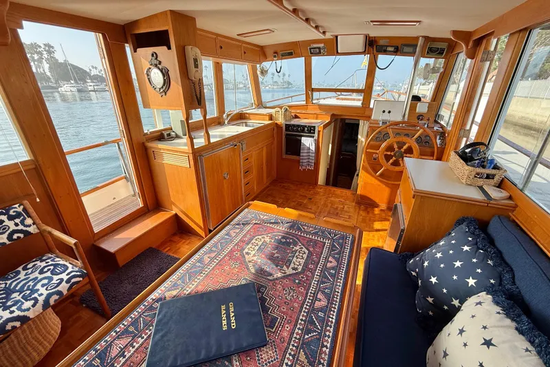 Slide: The Image of Interior of 1982 Grand Banks 42 Motoryacht with wooden finish and nautical decor. - 7