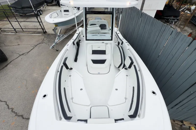 Slide: The Image of 2026 Tidewater 220 LXF boat interior with white seating and modern design. - 10