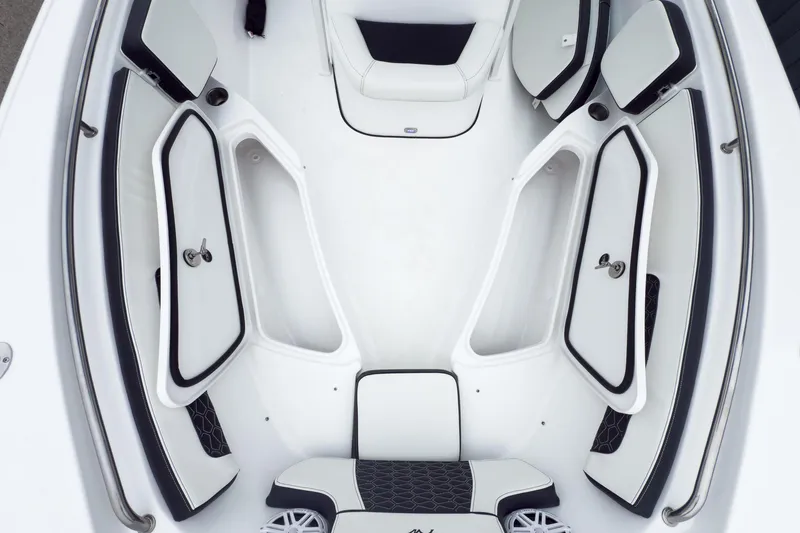 Slide: The Image of 2026 Tidewater 220 LXF boat interior with storage compartments and motor view. - 12