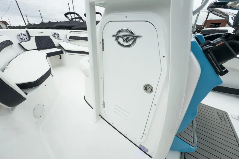 Slide: The Image of 2026 Tidewater 220 LXF boat bow with storage compartment and sleek design. - 14