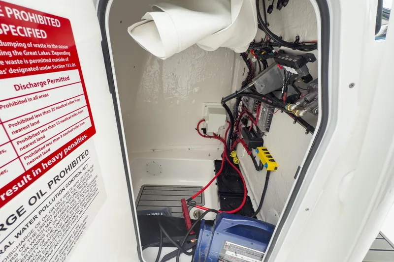 Slide: The Image of 2026 Tidewater 220 LXF boat interior with seating and helm details. - 15