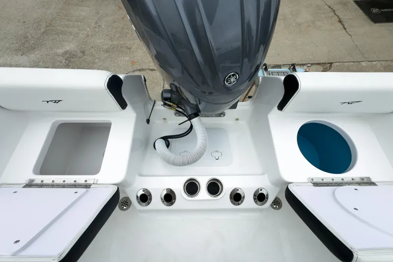 Slide: The Image of 2026 Tidewater 198 CC Adventure boat interior with engine and storage compartments. - 16