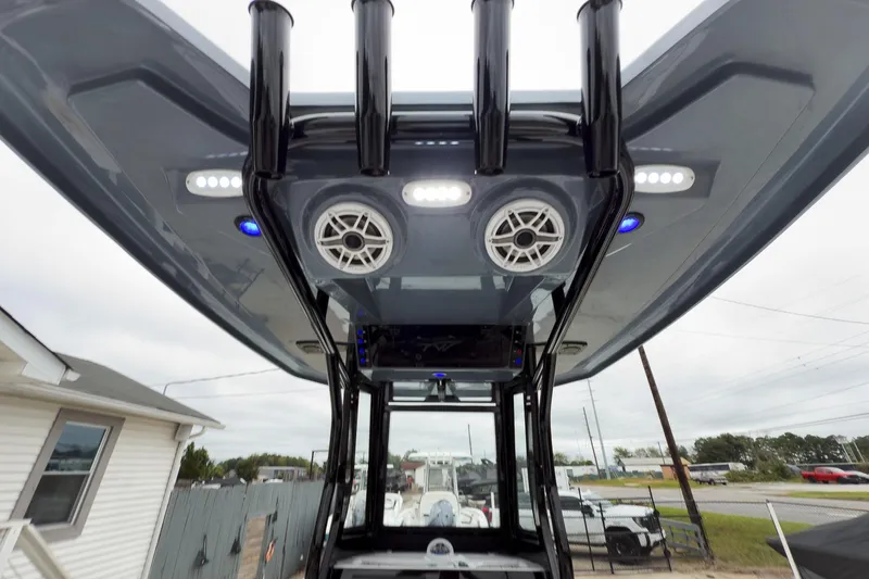 Slide: The Image of 2026 Tidewater 2500 Carolina Bay boat with speakers and lights on the T-top. - 18