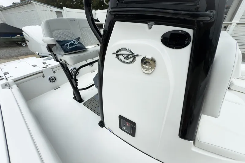 Slide: The Image of 2026 Tidewater 2500 Carolina Bay boat interior with seating and control panel. - 22