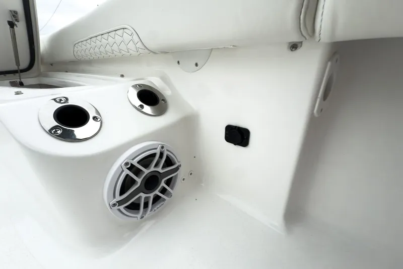 Slide: The Image of 2026 Tidewater 2500 Carolina Bay boat interior with speaker and rod holders. - 24