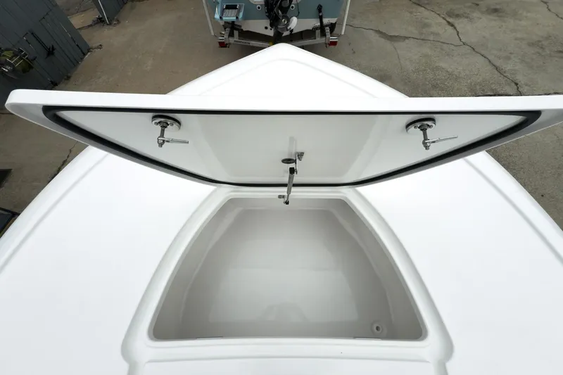 Slide: The Image of Open storage compartment on 2026 Tidewater 2500 Carolina Bay boat, showcasing spacious interior. - 27