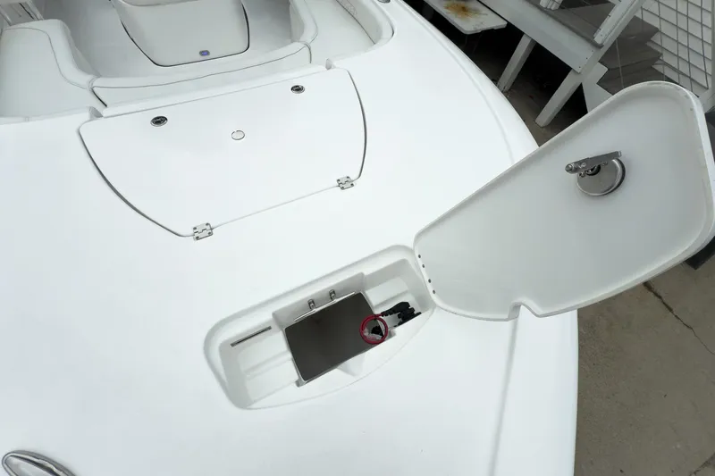Slide: The Image of Open storage compartment on 2026 Tidewater 2500 Carolina Bay boat deck. - 28