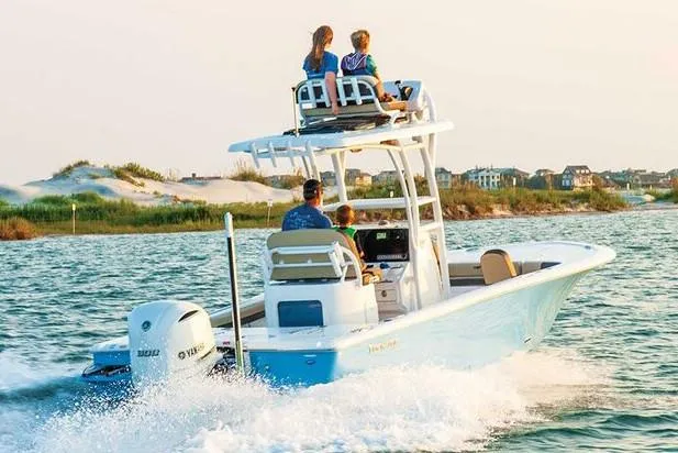 Slide: The Image of 2026 Tidewater 2500 Carolina Bay boat with powerful 300 V6 engine, parked outdoors. - 3