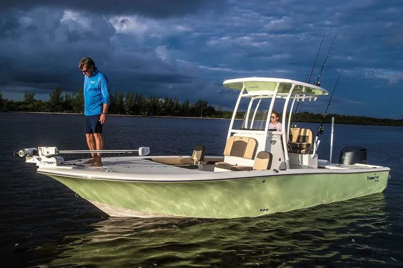 Slide: The Image of 2026 Tidewater 2500 Carolina Bay boat interior with steering console and seating. - 4