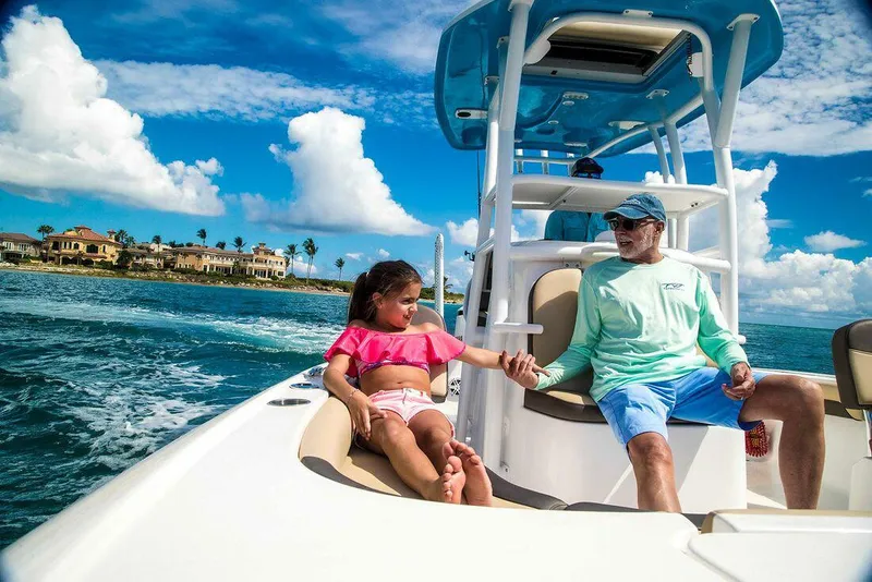 Slide: The Image of 2026 Tidewater 2500 Carolina Bay boat interior with open storage compartments and seating. - 6