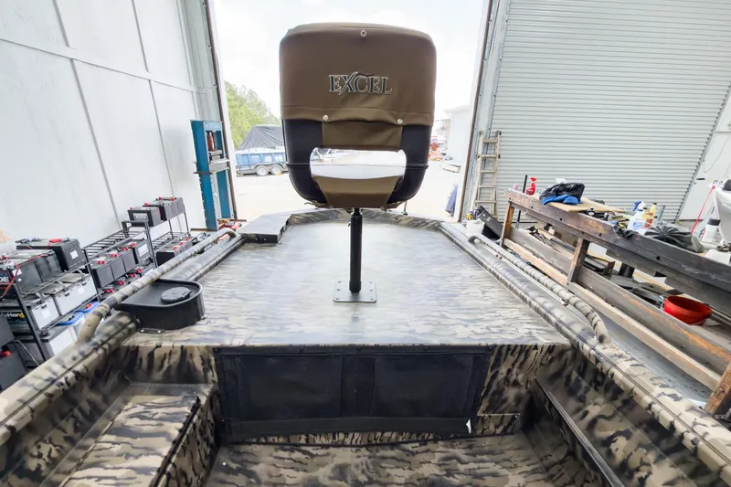 Slide: The Image of 2026 Excel 1751 Viper F4 boat interior with camo design and branded seat. - 15
