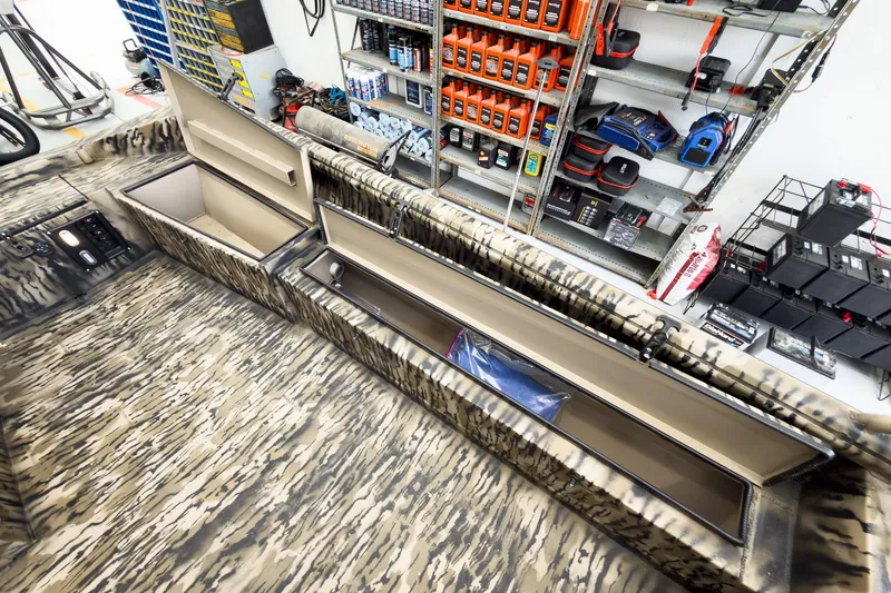 Slide: The Image of Interior of 2026 Excel 1751 Viper F4 boat with storage compartments open. - 21