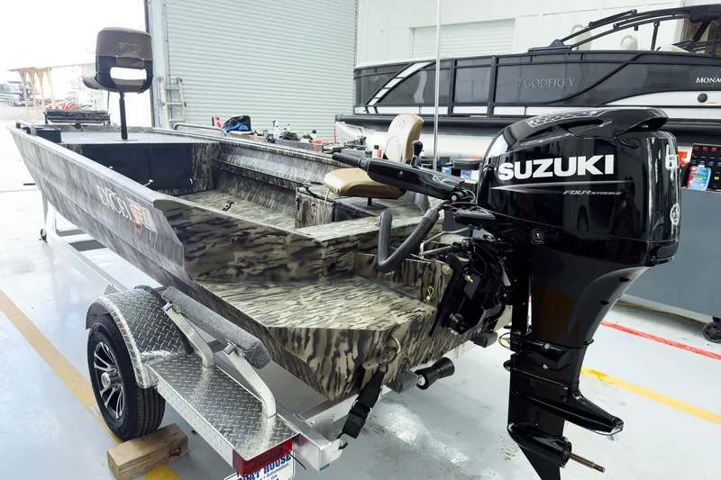 Slide: The Image of 2026 Excel 1751 Viper F4 boat with Suzuki outboard motor in a showroom. - 4