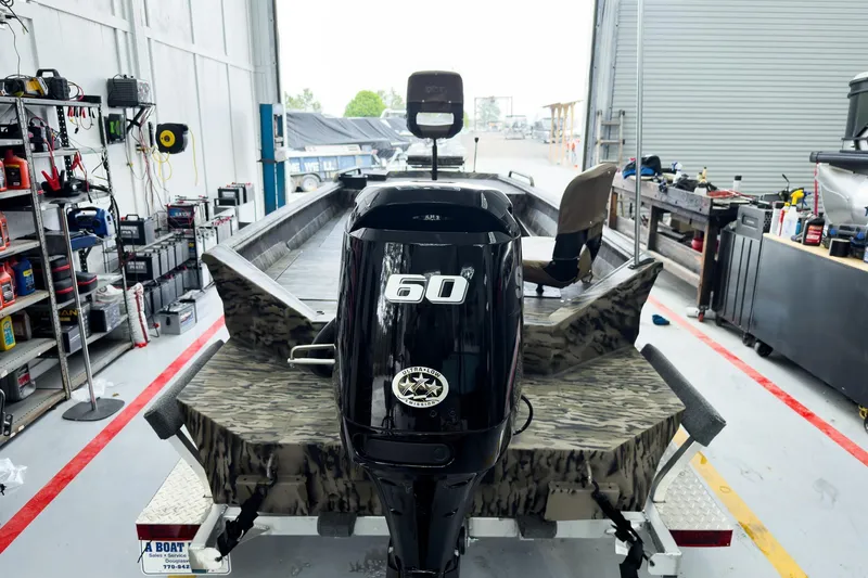 Slide: The Image of 2026 Excel 1751 Viper F4 boat in workshop, featuring a 60 HP outboard motor. - 5