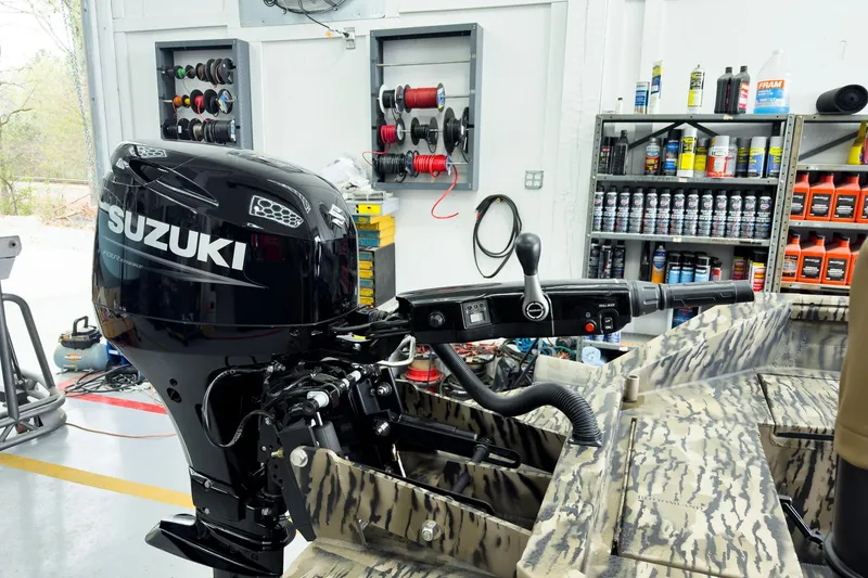 Slide: The Image of Outboard motor on Excel 1751 Viper F4 boat, 2026 model, in a workshop setting. - 8