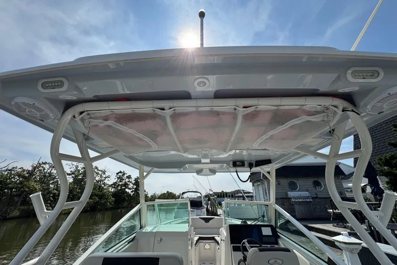 Slide: The Image of 2022 Sailfish 276 DC boat with sunroof and modern cockpit design. - 10
