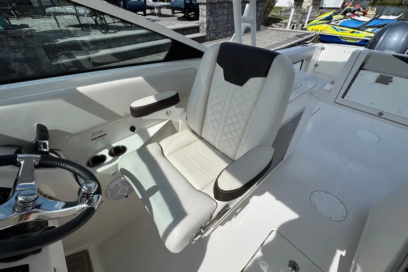 Slide: The Image of Luxury seating on 2022 Sailfish 276 DC boat, featuring premium upholstery and sleek design. - 14