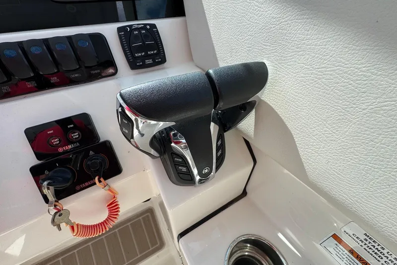 Slide: The Image of Control panel of 2022 Sailfish 276 DC boat with Yamaha throttle and switches. - 15
