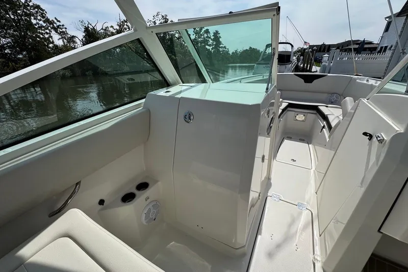 Slide: The Image of 2022 Sailfish 276 DC boat interior with seating and storage, featuring sleek design and modern amenities. - 17