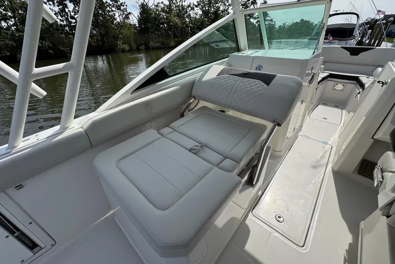 Slide: The Image of 2022 Sailfish 276 DC boat interior with luxurious seating and sleek design. - 27
