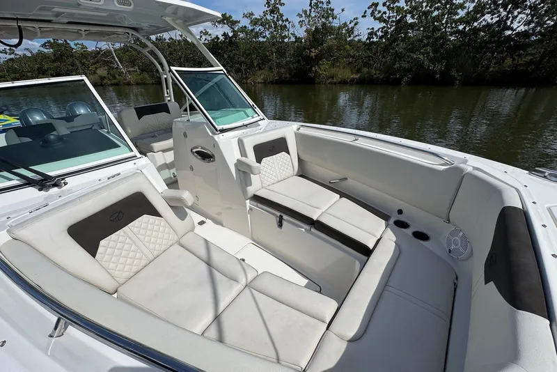 Slide: The Image of Luxurious interior of 2022 Sailfish 276 DC boat with comfortable seating and scenic water view. - 32