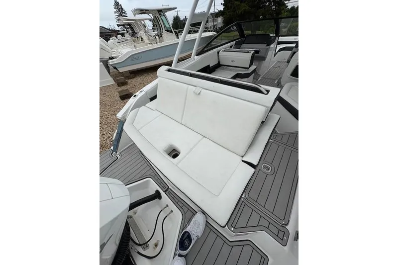 Slide: The Image of 2025 Cobalt R4 Outboard boat interior with white seating and modern design. - 14