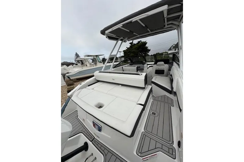 Slide: The Image of 2025 Cobalt R4 Outboard boat with sleek white seating and modern design. - 19
