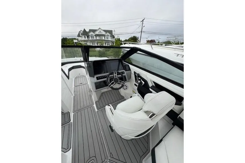 Slide: The Image of 2025 Cobalt R4 Outboard boat interior with sleek design and modern dashboard. - 28