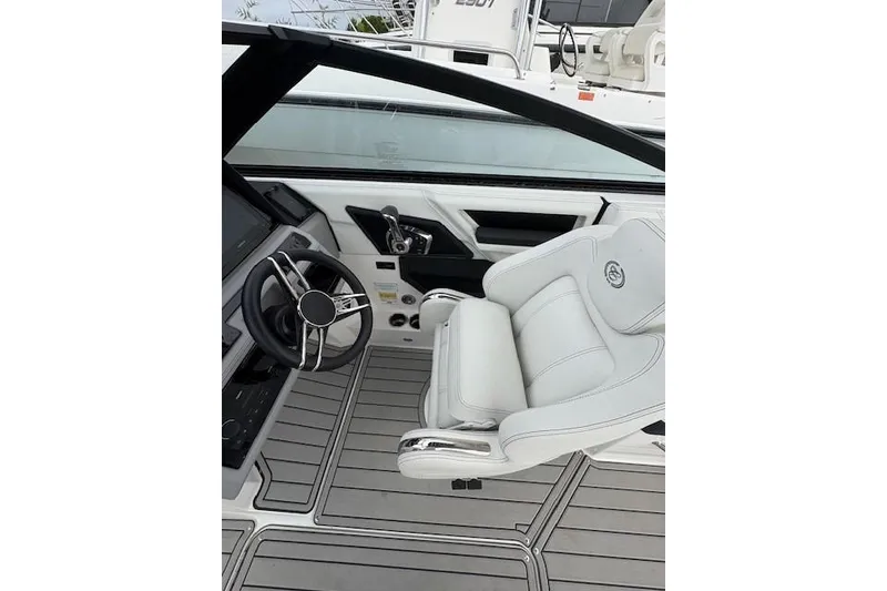 Slide: The Image of 2025 Cobalt R4 Outboard boat interior with sleek steering and luxurious seating. - 31