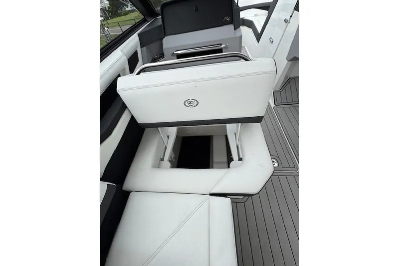 Slide: The Image of 2025 Cobalt R4 Outboard boat interior with white seating and sleek design. - 35