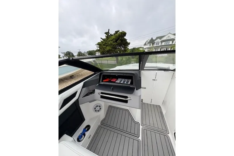Slide: The Image of 2025 Cobalt R4 Outboard boat interior with modern dashboard and sleek design. - 36
