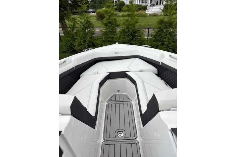 Slide: The Image of 2025 Cobalt R4 Outboard boat interior with sleek white seating and modern design. - 41