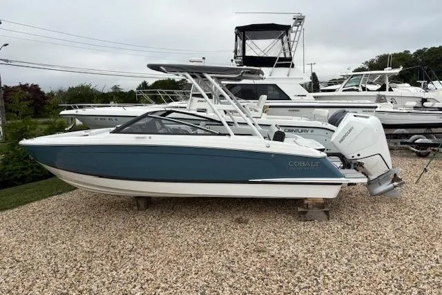 Slide: The Image of 2025 Cobalt R4 Outboard boat displayed on gravel, featuring sleek design and modern outboard engine. - 51