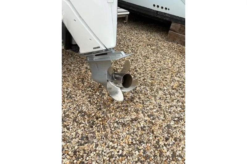 Slide: The Image of 2025 Cobalt R4 Outboard motor propeller on gravel surface. - 7