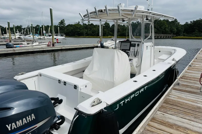 Slide: The Image of 2009 Southport 26 Center Console boat docked with Yamaha engines. - 20