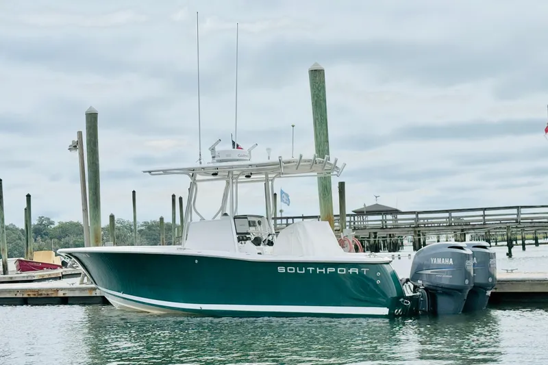 Slide: The Image of 2009 Southport 26 Center Console boat docked with Yamaha engines. - 4